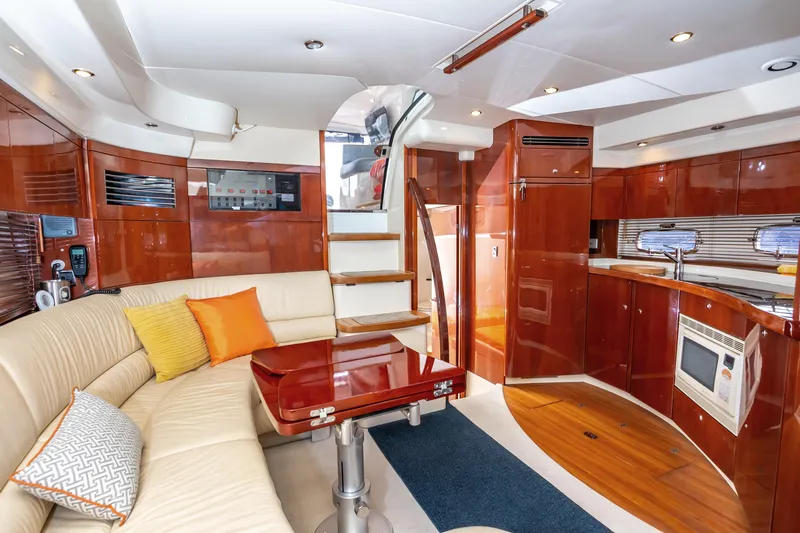 Ami Kids Donation: Meditrina Yacht Photos Pics Luxurious interior of 2006 Fairline Targa 47 GT yacht with elegant wood finishes and modern amenities.