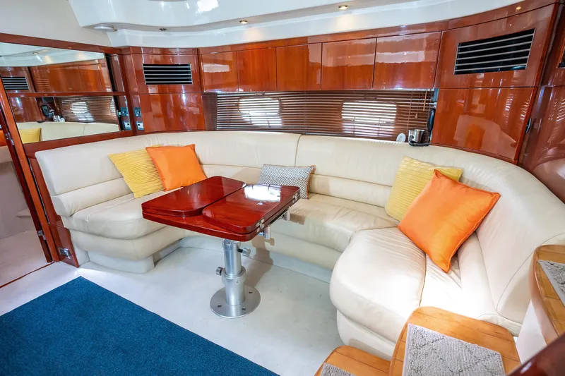 Ami Kids Donation: Meditrina Yacht Photos Pics Luxurious 2006 Fairline Targa 47 GT yacht interior with plush seating and vibrant cushions.