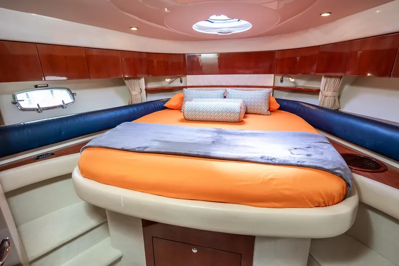 Ami Kids Donation: Meditrina Yacht Photos Pics Luxurious cabin interior of 2006 Fairline Targa 47 GT yacht with orange bedding.