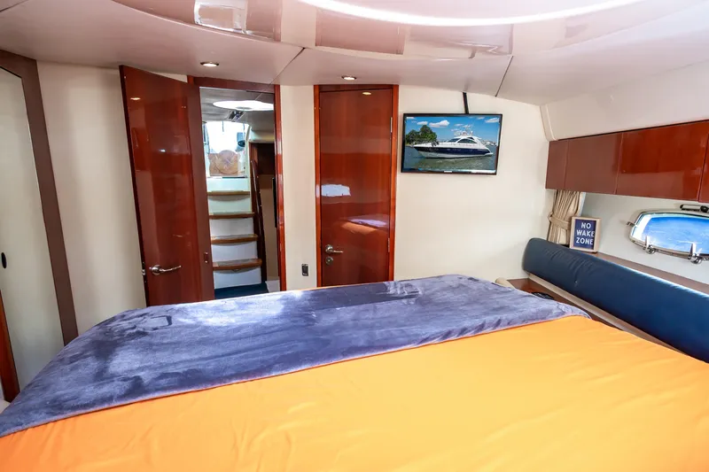Ami Kids Donation: Meditrina Yacht Photos Pics Luxurious 2006 Fairline Targa 47 GT yacht cabin with modern decor and cozy bedding.