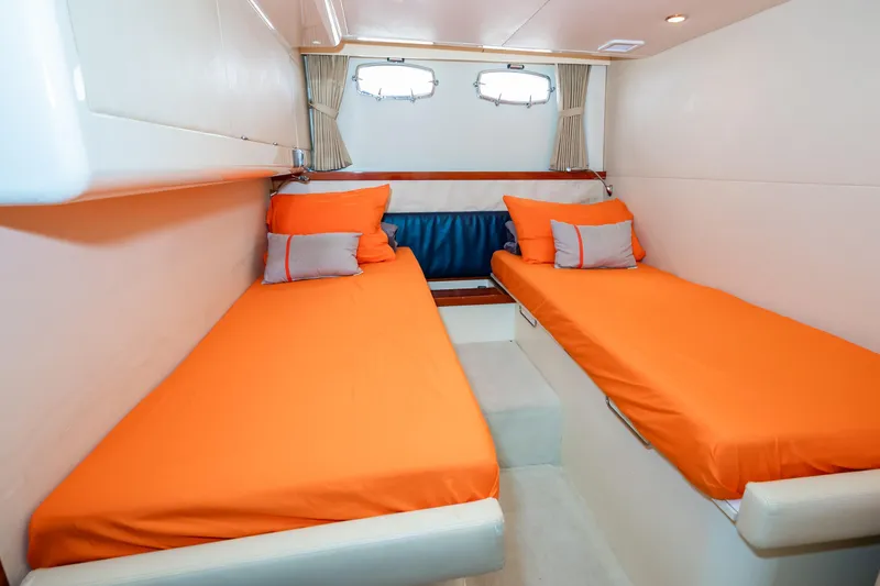 Ami Kids Donation: Meditrina Yacht Photos Pics 2006 Fairline Targa 47 GT cabin with twin orange beds and nautical decor.