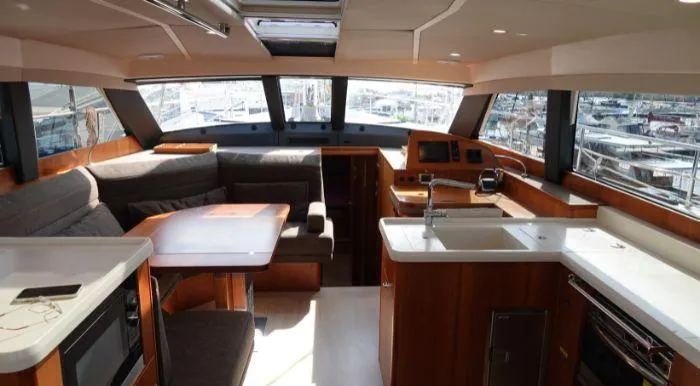 Heolia Yacht Photos Pics Luxurious interior of 2018 Hanse Moody 54 DS yacht with modern kitchen and seating area.