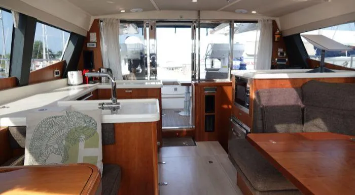 Heolia Yacht Photos Pics Interior of 2018 Hanse Moody 54 DS yacht with modern kitchen and seating area.