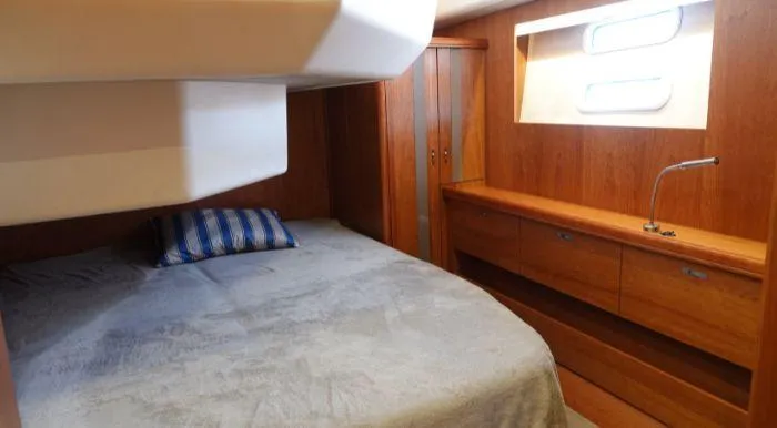 Heolia Yacht Photos Pics Cozy bedroom in 2018 Hanse Moody 54 DS yacht with wooden interior and natural light.