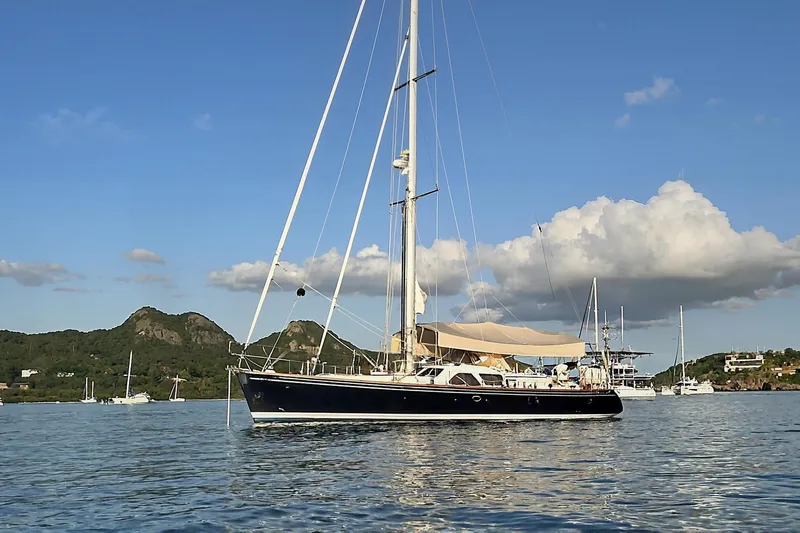 Clarity Yacht Photos Pics Sailing yacht Hylas 54, 2009 model, anchored in scenic coastal waters.