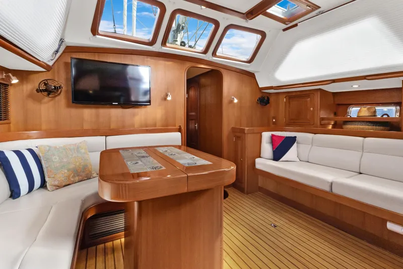 Clarity Yacht Photos Pics Luxurious 2009 Hylas 54 yacht interior with elegant wood finish and comfortable seating.