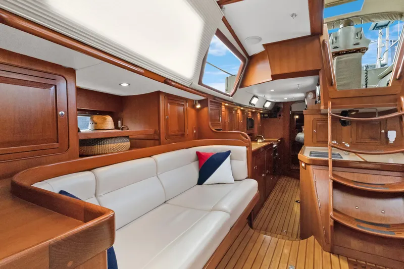 Clarity Yacht Photos Pics Luxurious 2009 Hylas 54 yacht interior with elegant wood finish and comfortable seating.