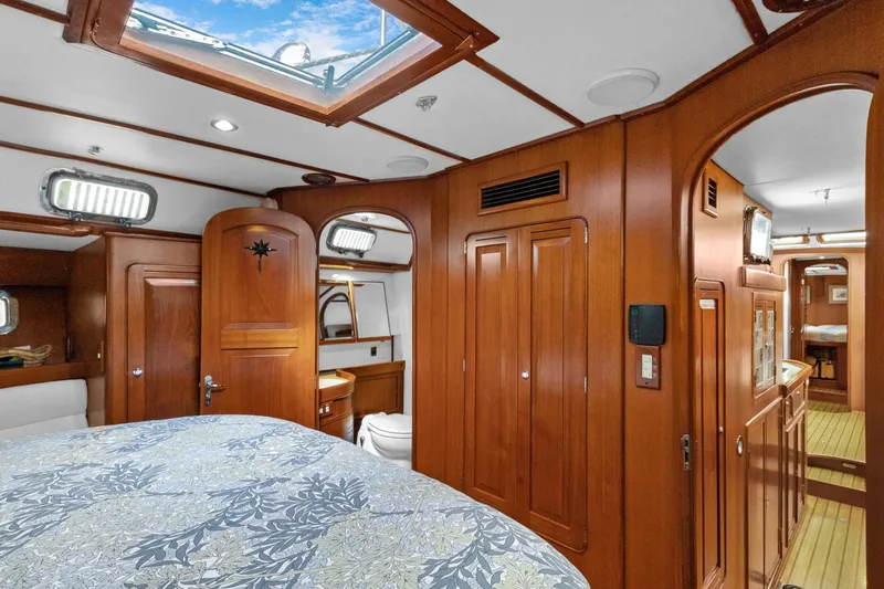 Clarity Yacht Photos Pics Luxurious 2009 Hylas 54 yacht interior with wood paneling and skylight.