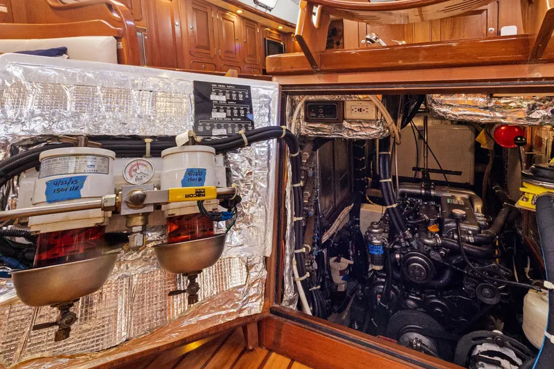 Clarity Yacht Photos Pics Engine room of a 2009 Hylas 54 yacht, showcasing detailed mechanical components.