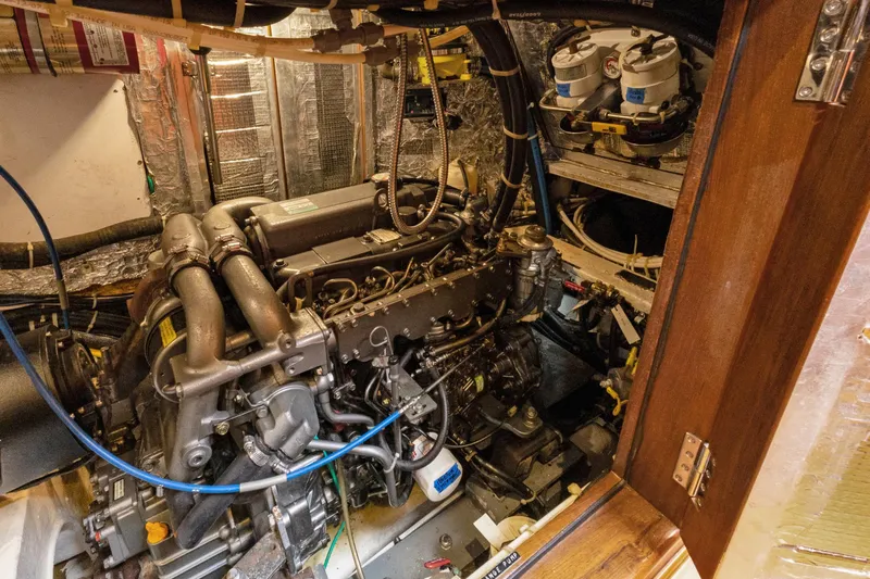 Clarity Yacht Photos Pics Engine room of a 2009 Hylas 54 yacht, showcasing detailed mechanical components.