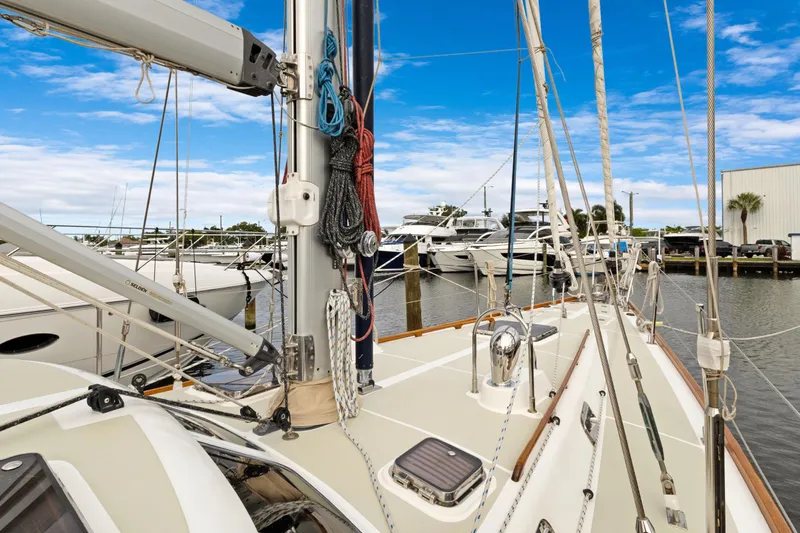 Clarity Yacht Photos Pics 2009 Hylas 54 sailboat docked at marina with clear blue sky.
