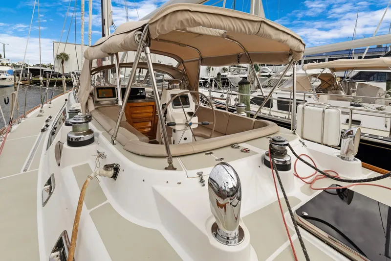 Clarity Yacht Photos Pics 2009 Hylas 54 yacht cockpit with steering wheel, winches, and navigation equipment.