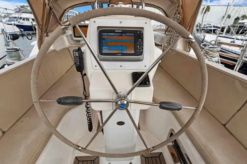 Clarity Yacht Photos Pics Steering wheel and navigation system on a 2009 Hylas 54 yacht cockpit.