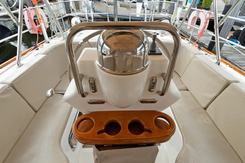 Clarity Yacht Photos Pics Cockpit of 2009 Hylas 54 yacht with steering wheel and cup holders.