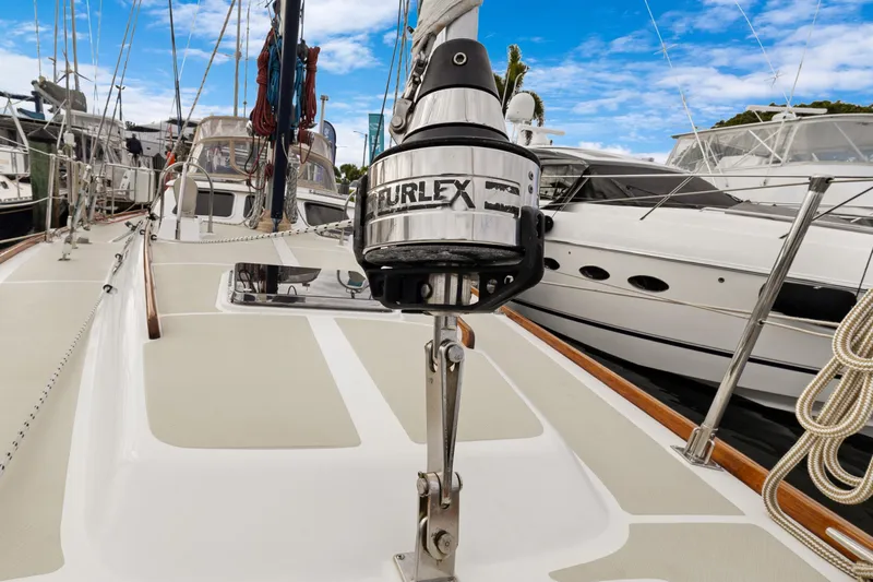 Clarity Yacht Photos Pics 2009 Hylas 54 sailboat deck with Furlex system, docked among other yachts.