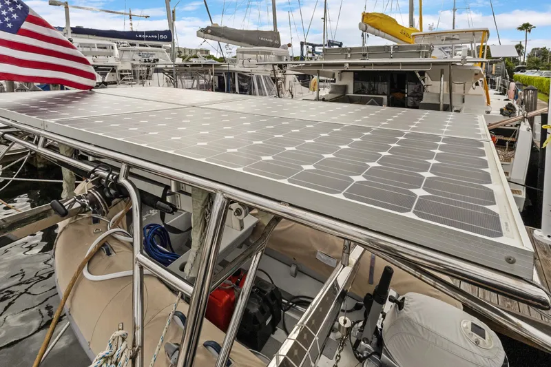 Clarity Yacht Photos Pics 2009 Hylas 54 yacht with solar panels and American flag at marina.