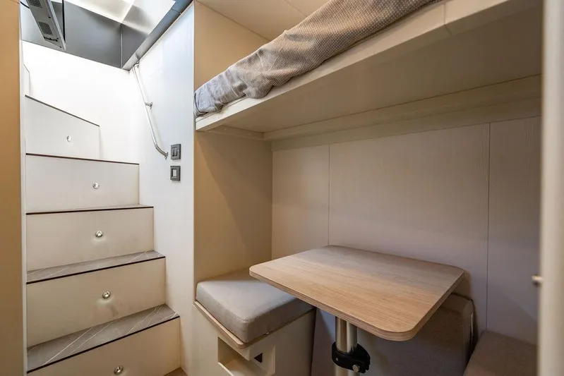 Kingship Yacht Photos Pics 2023 Absolute 64 Navetta interior with compact seating and stairs.