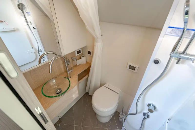 Kingship Yacht Photos Pics Luxurious bathroom in 2023 Absolute 64 Navetta yacht with modern fixtures.