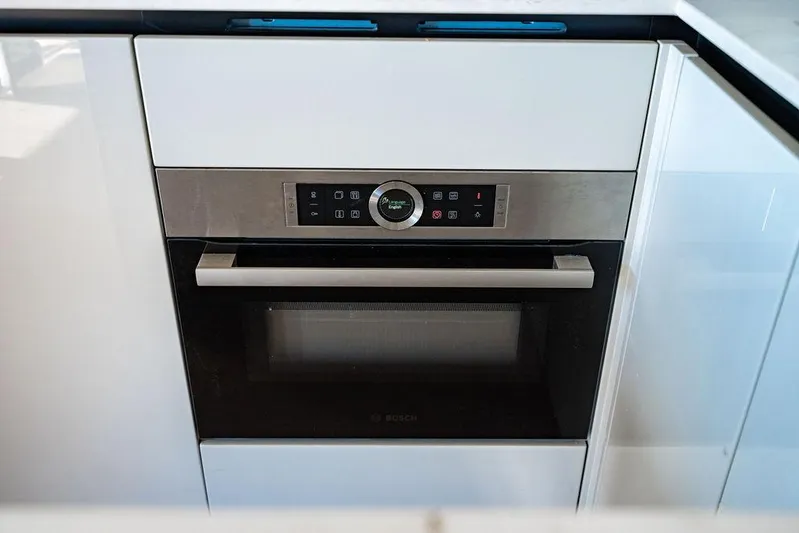 Kingship Yacht Photos Pics Modern built-in oven in Absolute 64 Navetta yacht kitchen, 2023 model.