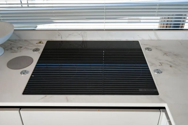 Kingship Yacht Photos Pics Modern stovetop on Absolute 64 Navetta yacht, 2023 model.