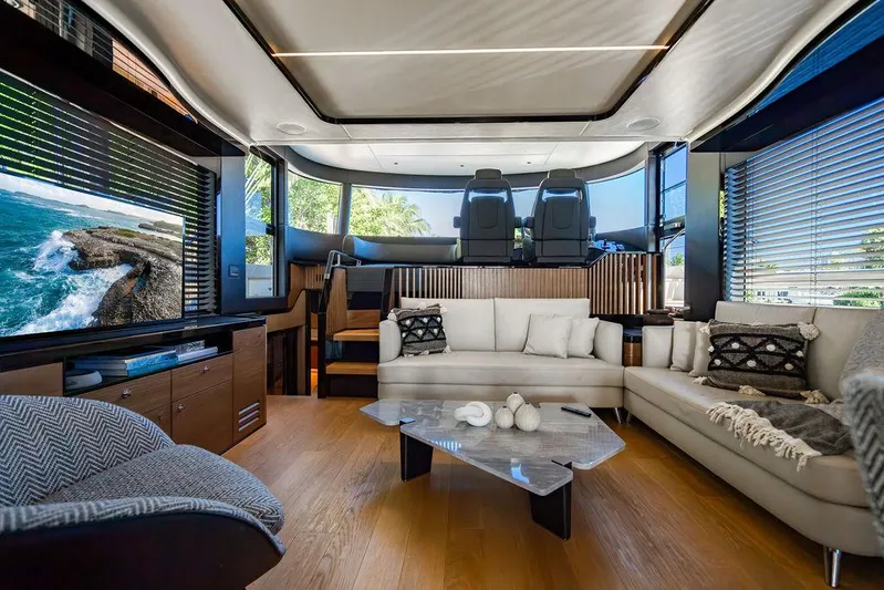 Kingship Yacht Photos Pics Luxurious interior of 2023 Absolute 64 Navetta yacht with modern furnishings and scenic views.