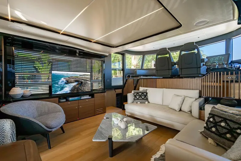 Kingship Yacht Photos Pics Luxurious interior of 2023 Absolute 64 Navetta yacht with modern furnishings and panoramic windows.