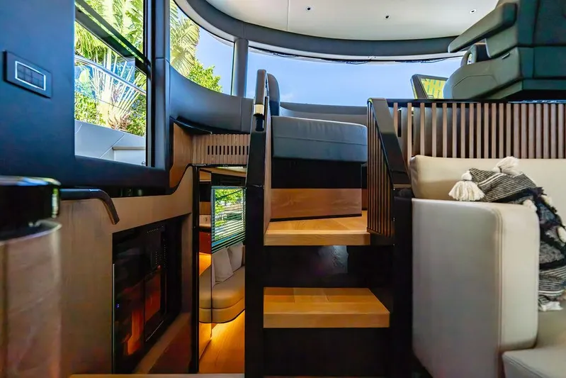 Kingship Yacht Photos Pics Luxurious interior of 2023 Absolute 64 Navetta yacht with modern staircase and seating.