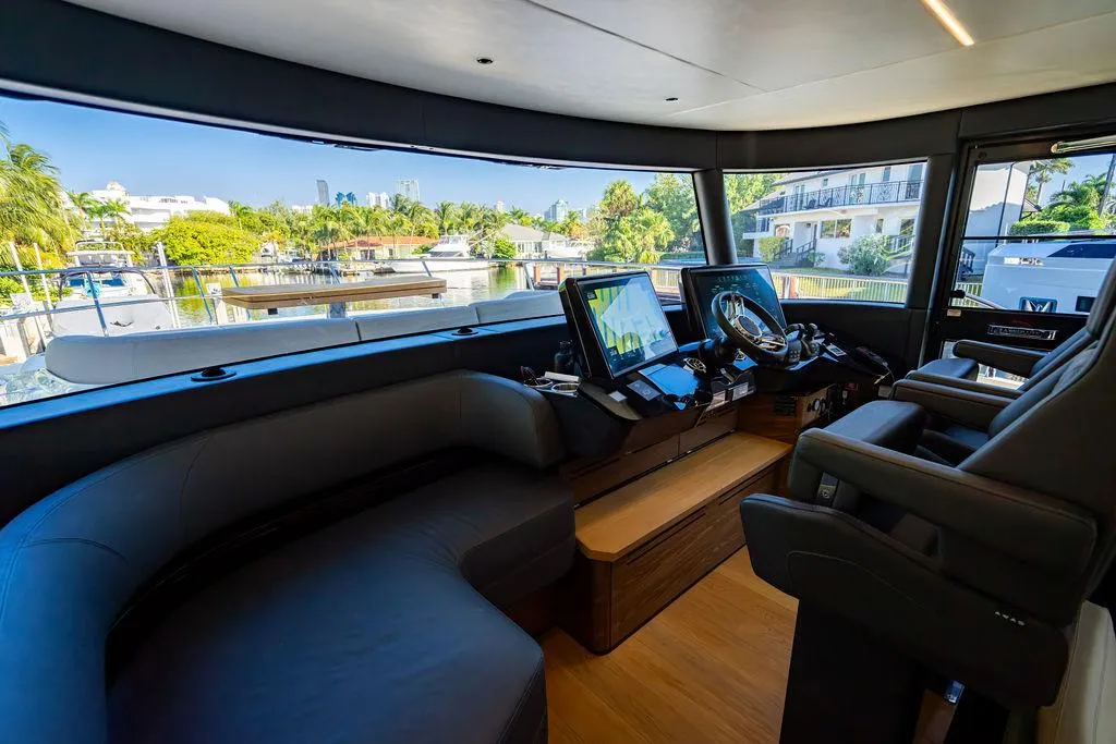 Luxurious interior of 2023 Absolute 64 Navetta yacht with modern navigation equipment.