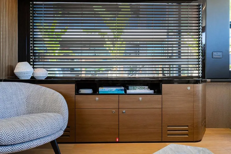 Kingship Yacht Photos Pics Interior of 2023 Absolute 64 Navetta yacht with modern furnishings and window blinds.