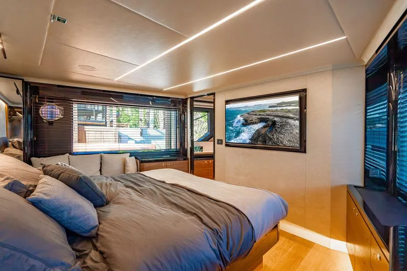 Kingship Yacht Photos Pics Luxurious bedroom interior of 2023 Absolute 64 Navetta yacht with modern design and scenic view.