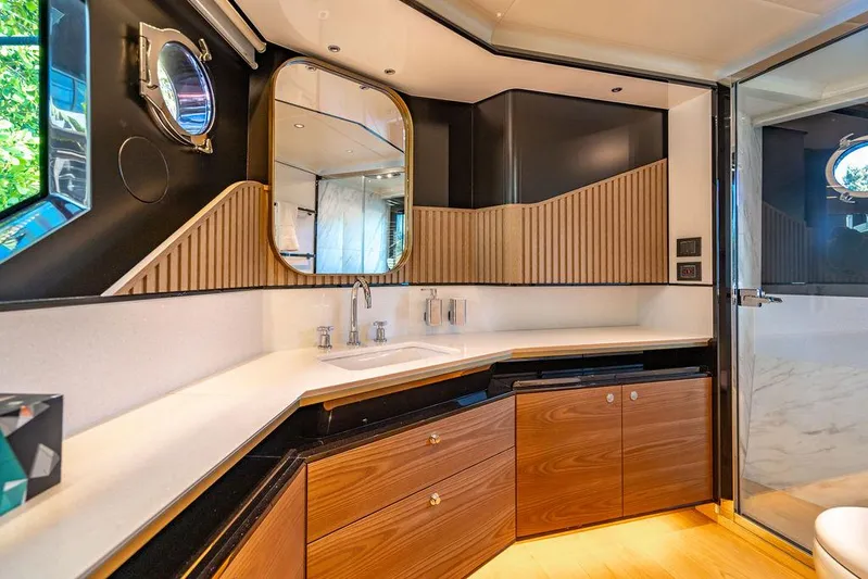 Kingship Yacht Photos Pics Luxurious bathroom in 2023 Absolute 64 Navetta yacht with modern design and wood accents.