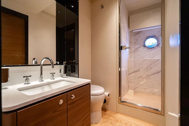Kingship Yacht Photos Pics Luxurious bathroom in 2023 Absolute 64 Navetta yacht with modern fixtures and shower.
