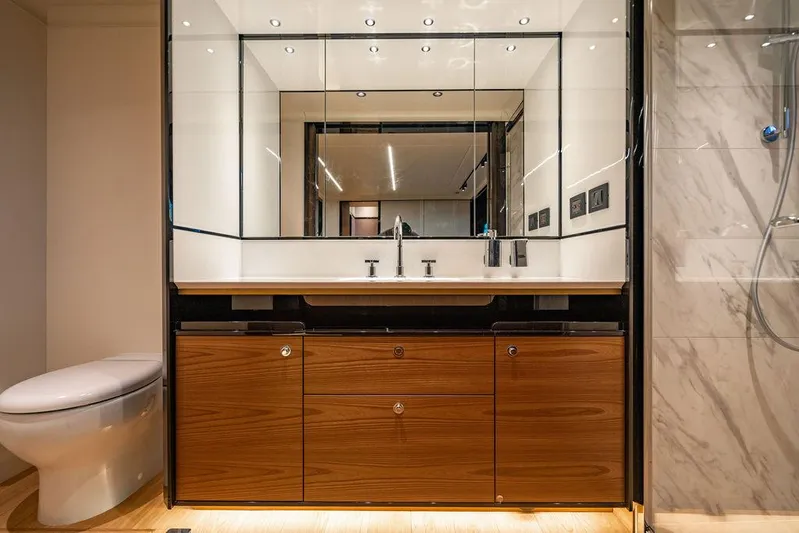 Kingship Yacht Photos Pics Luxurious bathroom in 2023 Absolute 64 Navetta yacht with modern fixtures and elegant design.