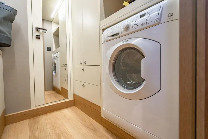 Kingship Yacht Photos Pics Laundry area with washing machine in 2023 Absolute 64 Navetta yacht.