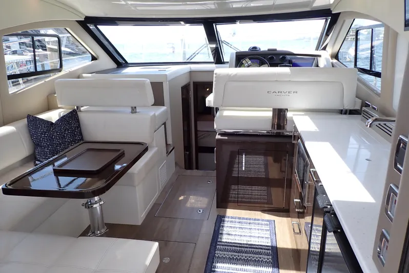  Yacht Photos Pics Luxurious interior of 2019 Carver C37 Coupe yacht with modern seating and sleek design.