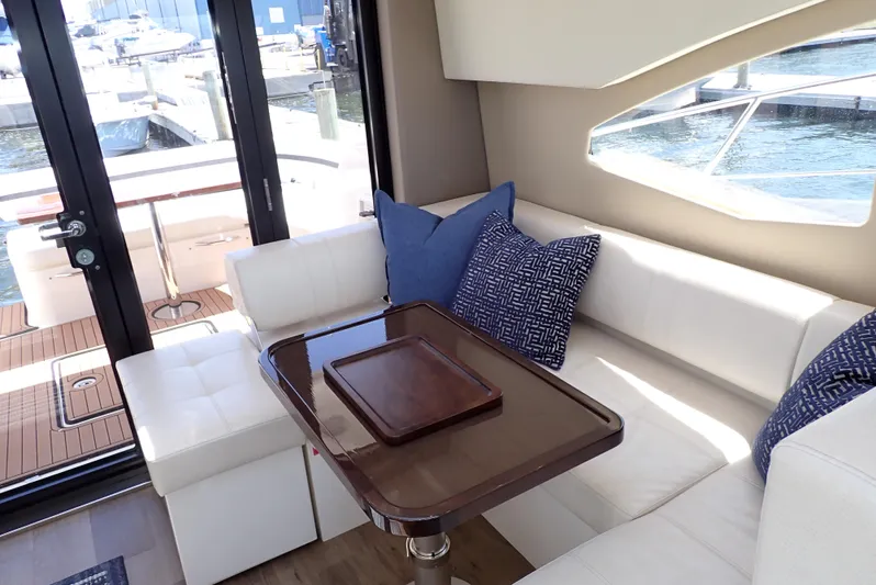  Yacht Photos Pics Luxurious interior of 2019 Carver C37 Coupe yacht with elegant seating and waterfront view.