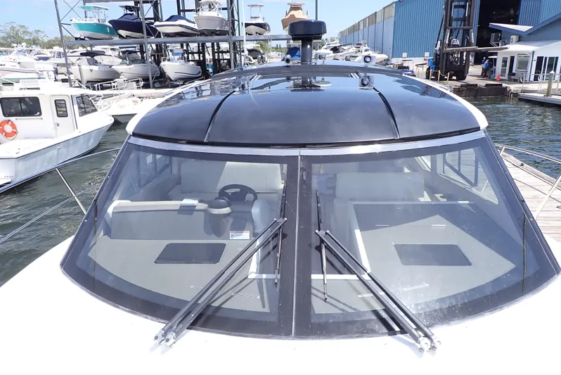  Yacht Photos Pics 2019 Carver C37 Coupe yacht with sleek design, docked at marina.