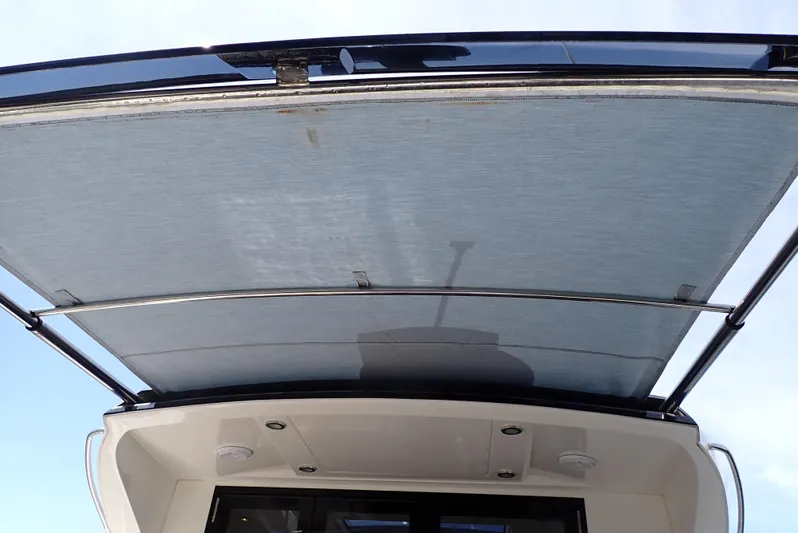  Yacht Photos Pics 2019 Carver C37 Coupe yacht with retractable sunroof, showcasing modern design and functionality.