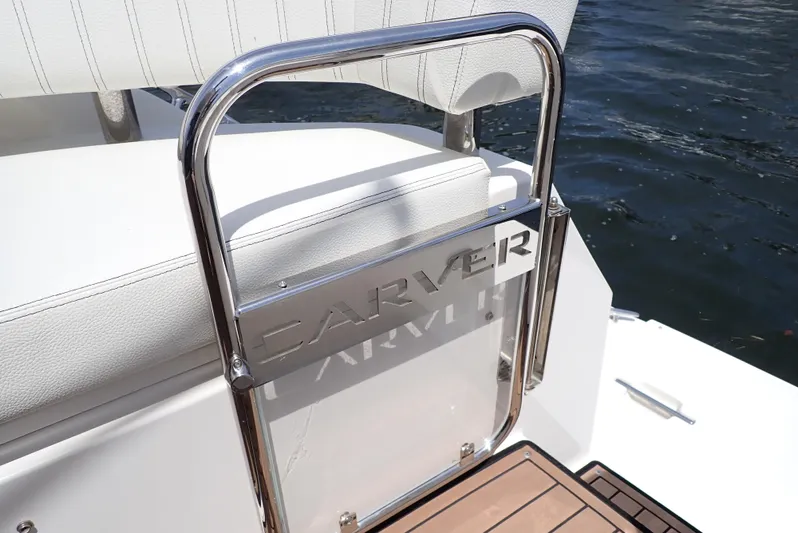  Yacht Photos Pics 2019 Carver C37 Coupe yacht with sleek railing and water backdrop.