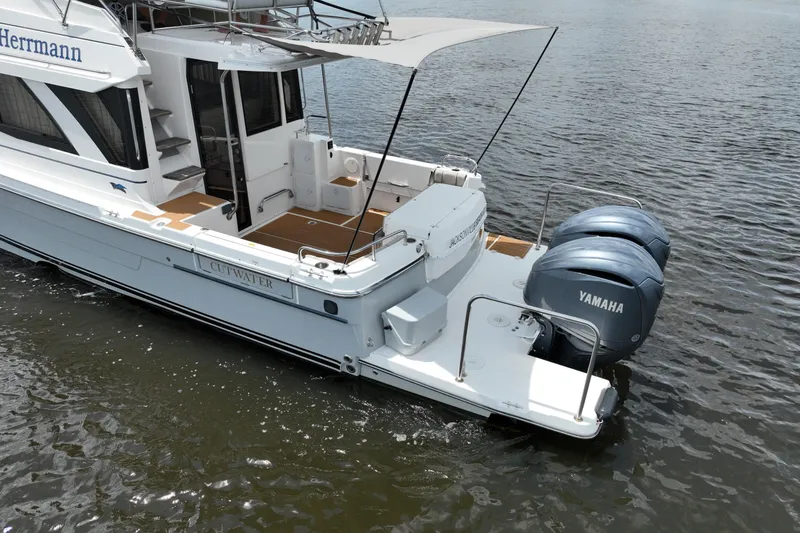 Motivated Yacht Photos Pics 2022 Cutwater C-32 CB boat with dual Yamaha engines on water.
