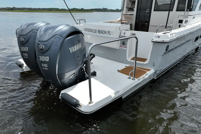 Motivated Yacht Photos Pics 2022 Cutwater C-32 CB boat with dual Yamaha 300 V6 engines on water.