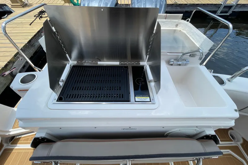Motivated Yacht Photos Pics Outdoor grill and sink on 2022 Cutwater C-32 CB boat deck.