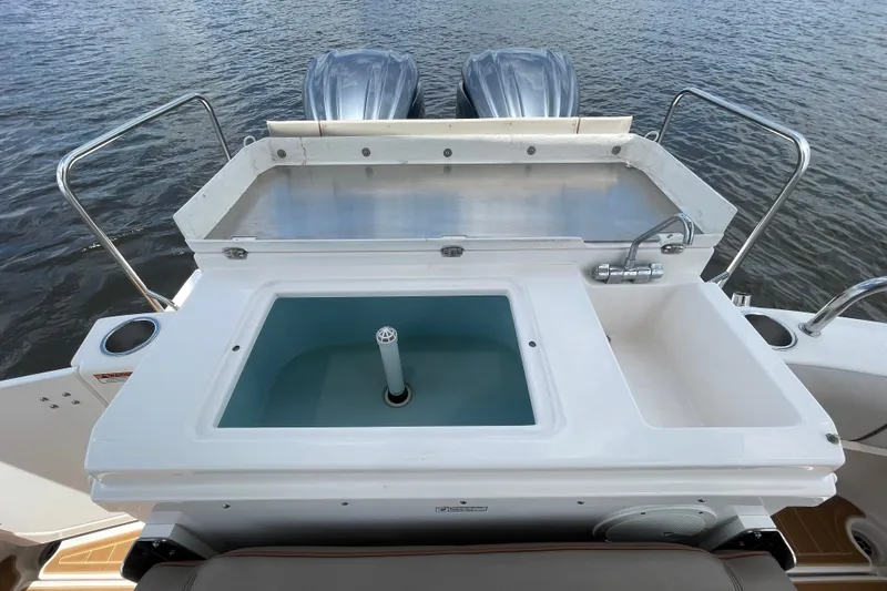 Motivated Yacht Photos Pics 2022 Cutwater C-32 CB boat with dual engines and onboard sink, docked on water.