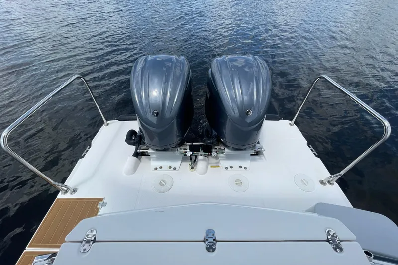 Motivated Yacht Photos Pics 2022 Cutwater C-32 CB boat with dual outboard motors on water.