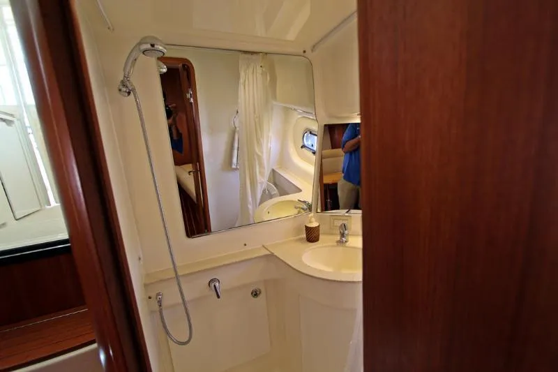  Yacht Photos Pics Bathroom interior of 2005 Tiara Yachts 3600 Sovran with shower and sink.