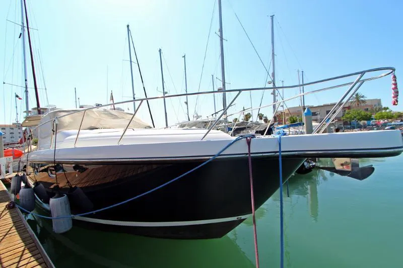  Yacht Photos Pics 2005 Tiara Yachts 3600 Sovran docked in a marina, side view.