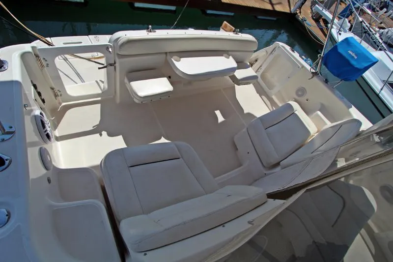  Yacht Photos Pics 2005 Tiara Yachts 3600 Sovran cockpit with white seating and table, docked at marina.