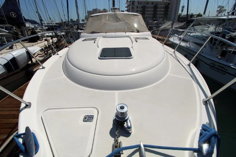  Yacht Photos Pics 2005 Tiara Yachts 3600 Sovran deck view in marina, showcasing sleek design and mooring equipment.