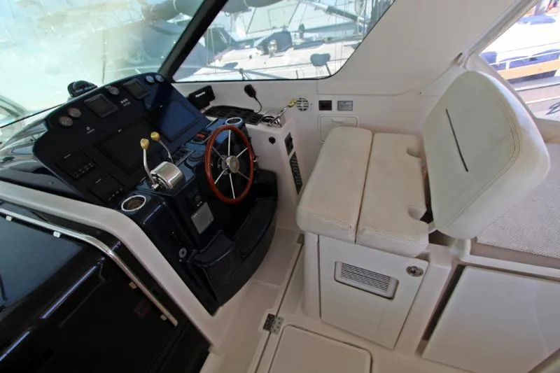  Yacht Photos Pics 2005 Tiara Yachts 3600 Sovran helm with steering wheel and navigation controls.