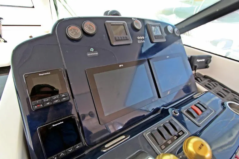  Yacht Photos Pics Control panel of a 2005 Tiara Yachts 3600 Sovran with navigation screens and gauges.